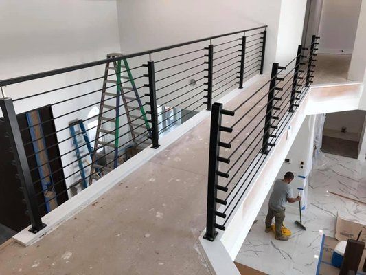 Finished custom steel loft railing installation, Ocala FL